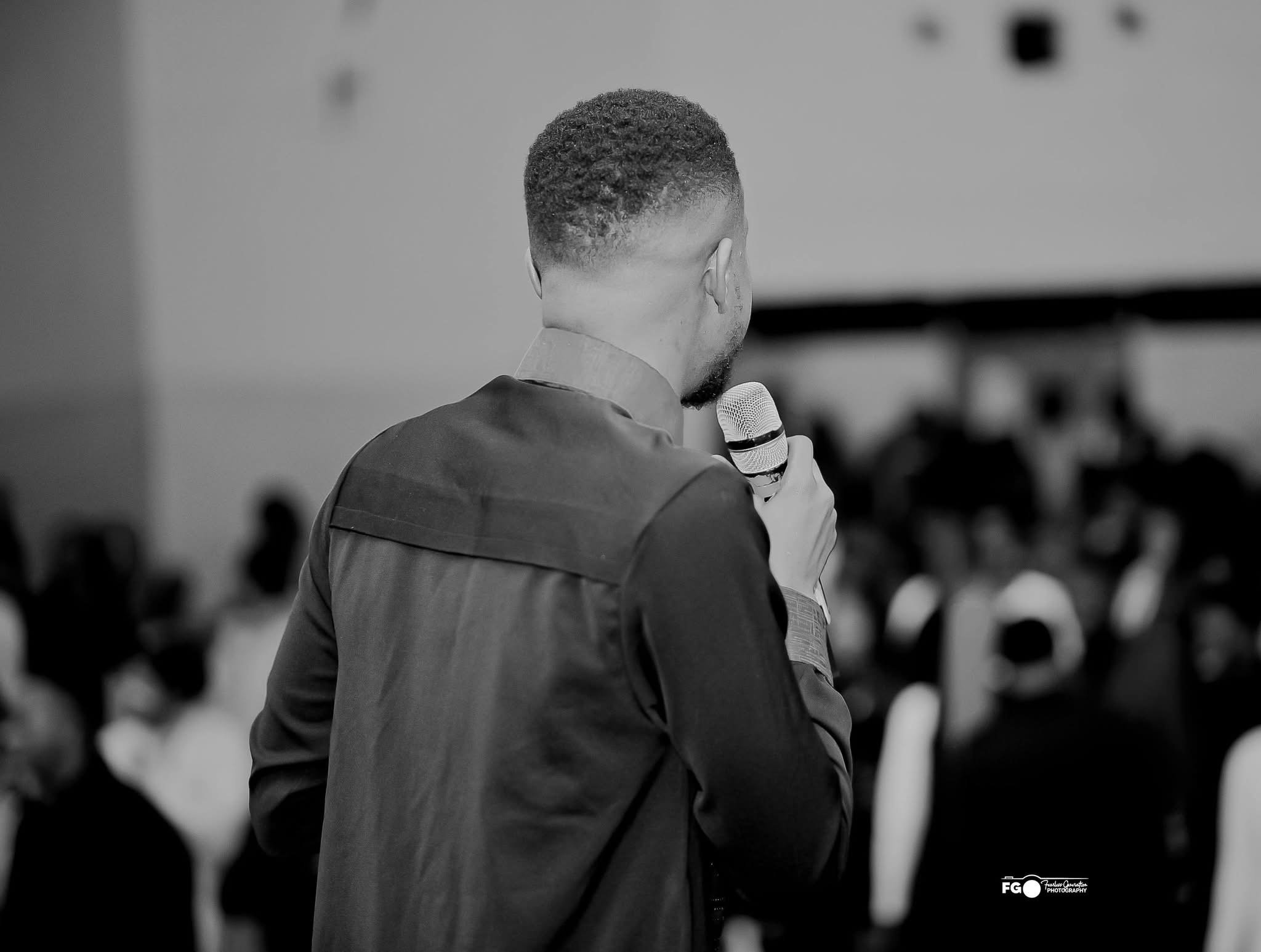 Rear view of the prophet speaking to the congregation