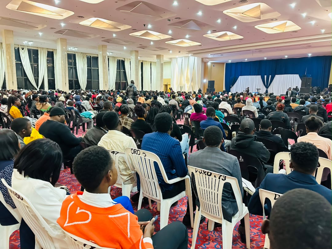 Wide view of a packed auditorium