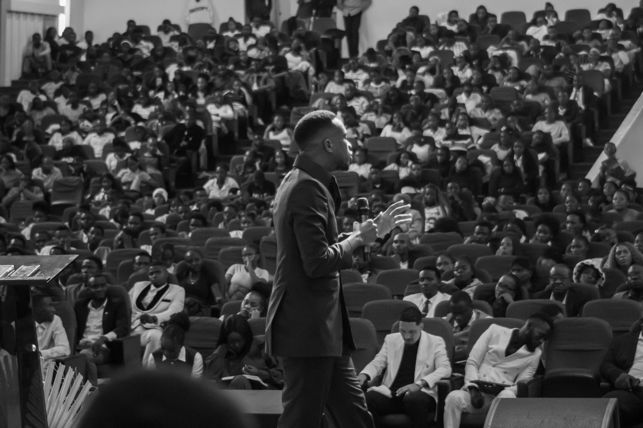 Prophet preaching to the crowd in black and white
